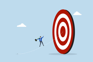 Set goal and take action to achieve goal or target, businessman walking on the line aiming at target bullseye