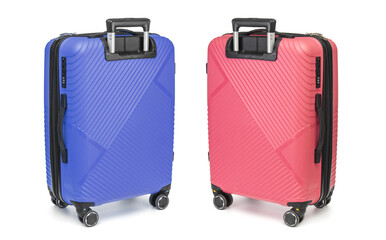 Two plastic suitcases close up isolated on white background