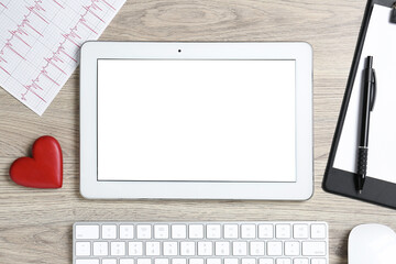 Cardiology. Flat lay composition with stethoscope and tablet on wooden table