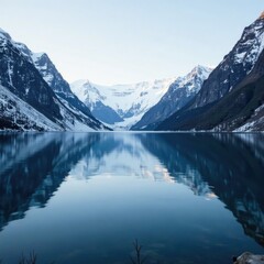 Fototapeta premium Snowy peaks reflected in calm fjord lake surface, nature, serene