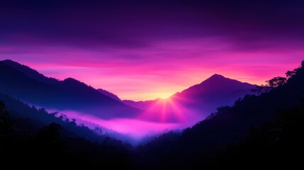 Fototapeta premium Vibrant sunrise over misty mountain valley with colorful sky and silhouetted peaks.