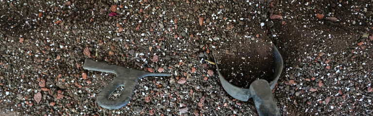 Soil, nutrient substrate and a scoop for transplanting potted plants with a composition of baking powder. banner