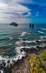 Mosteiros is a charming coastal village on São Miguel Island, Azores, known for its stunning ocean views, black sand beaches, dramatic lava rock formations rising from the sea, Portugal, drone, aerial