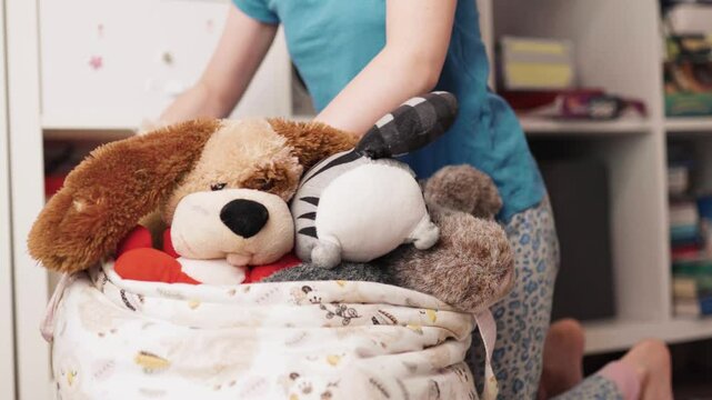 Chilchild, casual, caucasian, chore, chores, clean, clean up, cute, daughter, day, duty, education, toy, apartment, at home, bage, basket, beautifud cleans up her toys. Little girl tydies up her room.