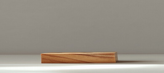 Wooden block displaying natural grain patterns minimalist studio product photography neutral background close-up rustic aesthetic