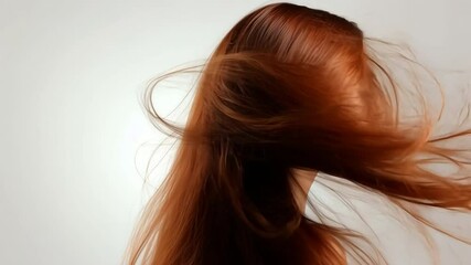 Red Hair Flowing: Long, luscious, auburn hair flows with effortless beauty, creating a captivating cascade of movement and texture. The subtle light enhances the fiery tones.