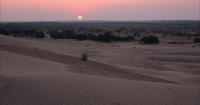 Sunset over desert dunes in Khuri, India