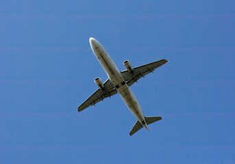 bottom view of a plane in the sky