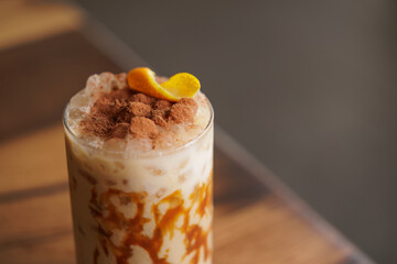 Cold and sweet summer drink, with milk, caramel, coffee, orange, cinnamon and lots of ice. A medium...