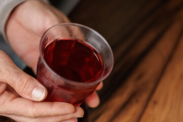 Close-up of a man's hands with a cup of hot tea.