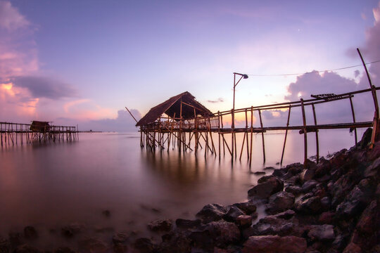 Bamboo pier on a beach at sunrise, Tanjung Kait, Mauk District, Tangerang Regency, Banten, West Java, Indonesia