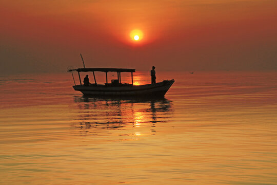 Silhouette of a traditional boat at Sunrise, Tanjung Kait, Mauk District, Tangerang Regency, Banten, West Java, Indonesia