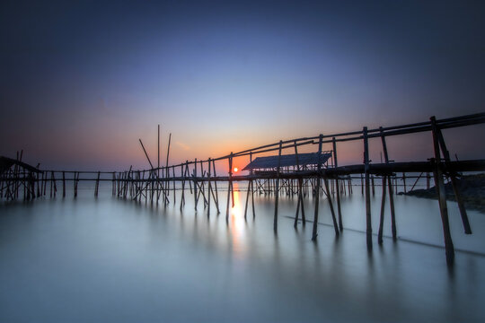 Bamboo pier on a beach at sunrise, Tanjung Kait, Mauk District, Tangerang Regency, Banten, West Java, Indonesia