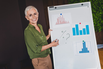 Photo of attractive lady financier assistant dressed shirt presenting graphics indoors workplace...