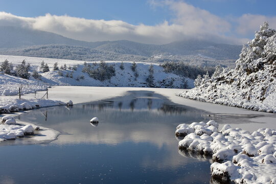Mt Zlatibor and lakeshore mountain landscape in the winter snow, Serbia