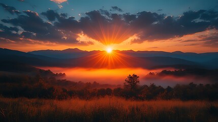 Sunrise over misty mountain valley