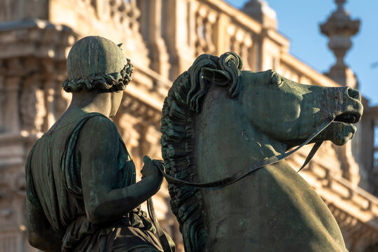 Turin, Italy. above the entrance of the Royal Palace are two Dioscuri, horse guard.