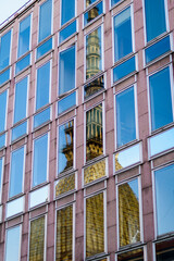 Fototapeta premium Turin, Italy. The iconic Mole Antonelliana reflected by the windows of the Rai television building.