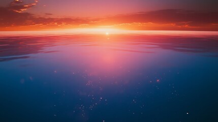 Obraz premium Vibrant sunset over tranquil ocean waters.