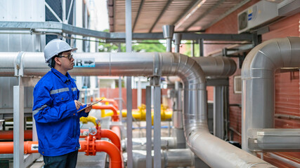 Engineer Overseeing Industrial Cooling System,Factory Technician Performing Machine Maintenance,Monitoring Machinery in Production Facility