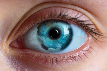 Fototapeta premium Hypnosis. Hypnotic clouds in woman's eye, closeup
