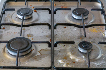 dirty gas burners in the kitchen. dirty gas stove.