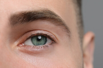 Fototapeta premium Closeup view of man with green eyes