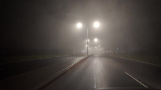 Driving Through Fog on an Empty Street at Night Toward a Crosswalk