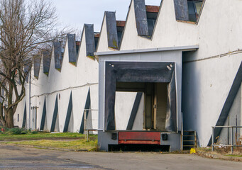 a ramp for unloading goods from trucks in an old abandoned production plant