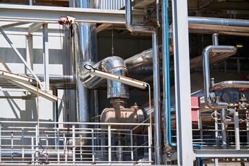 A detailed view of industrial pipelines in a chemical plant showcasing the complexity of...