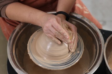 Hobby and craft. Woman making pottery indoors, closeup