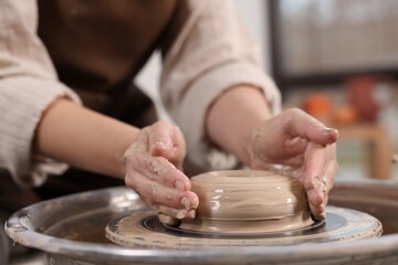 Hobby and craft. Woman making pottery indoors, closeup