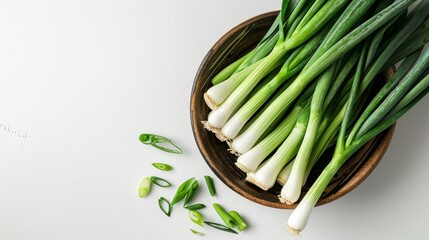 a bowl filled with fresh leek. empty space for your text