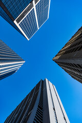 City downtown with skyscraper, low view. Office building in business district. Skyscraper building architecture. Business skyscraper of glass. Modern glass building. Skyscraper in city downtown