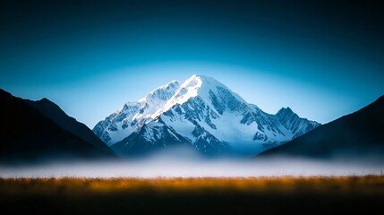 Majestic Snowcapped Mountain Peak at Dawn