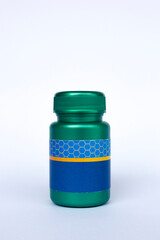 A dark green plastic bottles on a white background. 