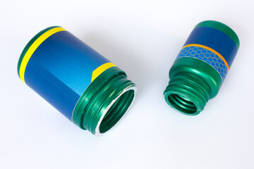 Two dark green plastic bottles on a white background. Horizontal.
