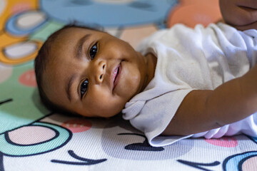 A little girl doing tummy time, a little girl. Newborn premature baby. Tummy time is fun time....