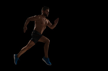 Runner at long sport run. Sportsman runner running isolated black. Sport run. Muscular man running. Sportsman jogger running. Man sportsman running for exercise. Sport athlete man run. Advertisement