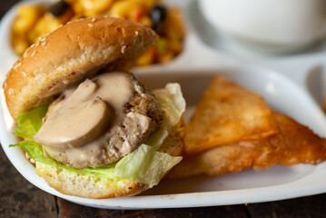 Chicken Slider with Mushroom Sauce, other food in background