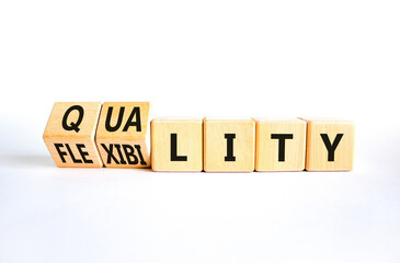 Quality or flexibility symbol. Concept words Quality Flexibility on wooden cubes. Beautiful white...