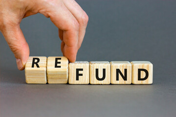 Fund or refund symbol. Concept words Fund Refund on wooden cubes. Beautiful grey table grey background. Businessman hand. Business and fund or refund concept. Copy space.