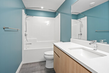 A bathroom with a white toilet and sink
