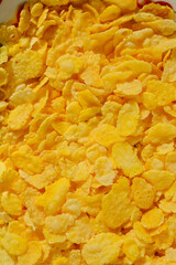 Close-up pile of crispy, golden-yellow cornflakes