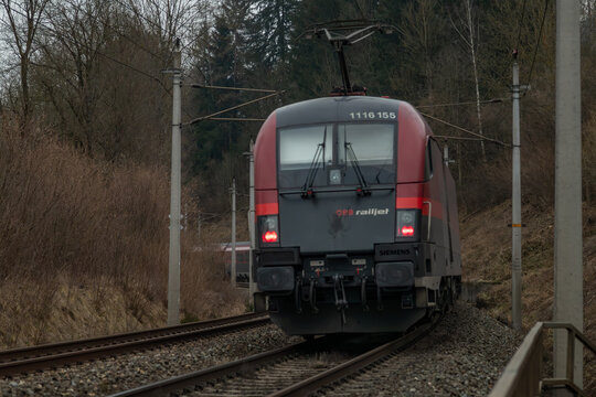 Cloudy morning near railway electic unit train near Kindberg Austria 02 01 2025