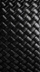 Fototapeta premium Close-up of a carbon fiber material with a woven pattern 
