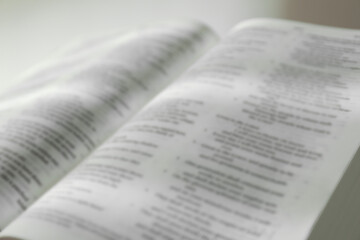 Open Holy Bible in English language, closeup