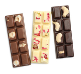 Different tasty chocolate bars isolated on white, top view