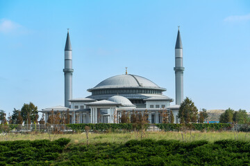 Fototapeta premium Ali Kuşçu Mosque as seen from Istanbul Airport under clear blue sky.