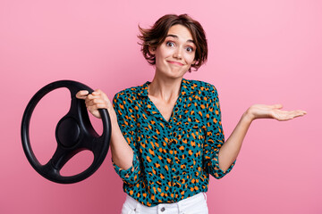 Portrait of funky indifferent girlish woman wear print blouse holding steering wheel shrug...